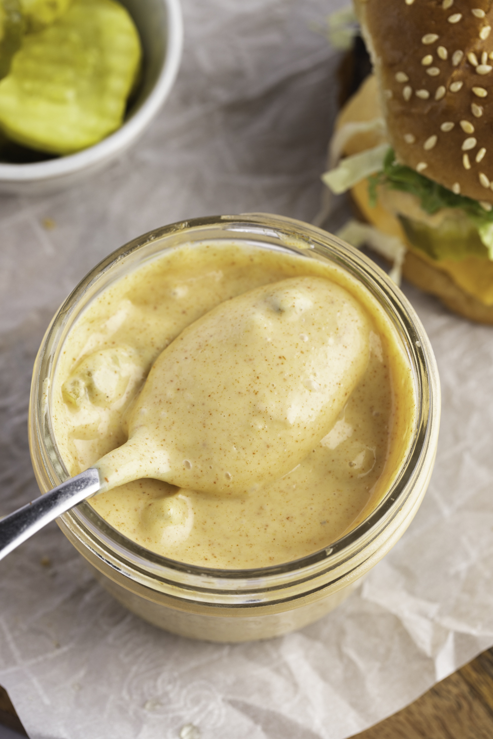 Sweet and Tangy Copycat McDonald's Big Mac Sauce in a Glass Jar with Burger Off to the Side