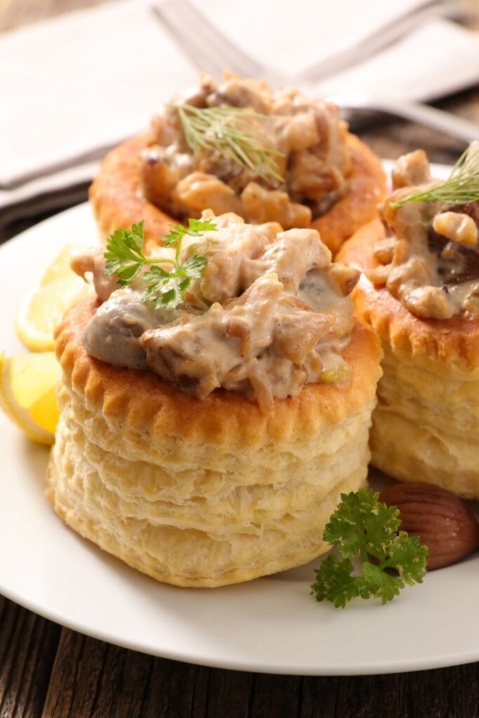 17 Best Vol-Au-Vent Recipes With a Retro Spin featuring Vol-Au-Vent Chicken Puff Pastry served on a plate