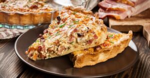 A slice of Quiche Lorraine with Bacon and Cheese