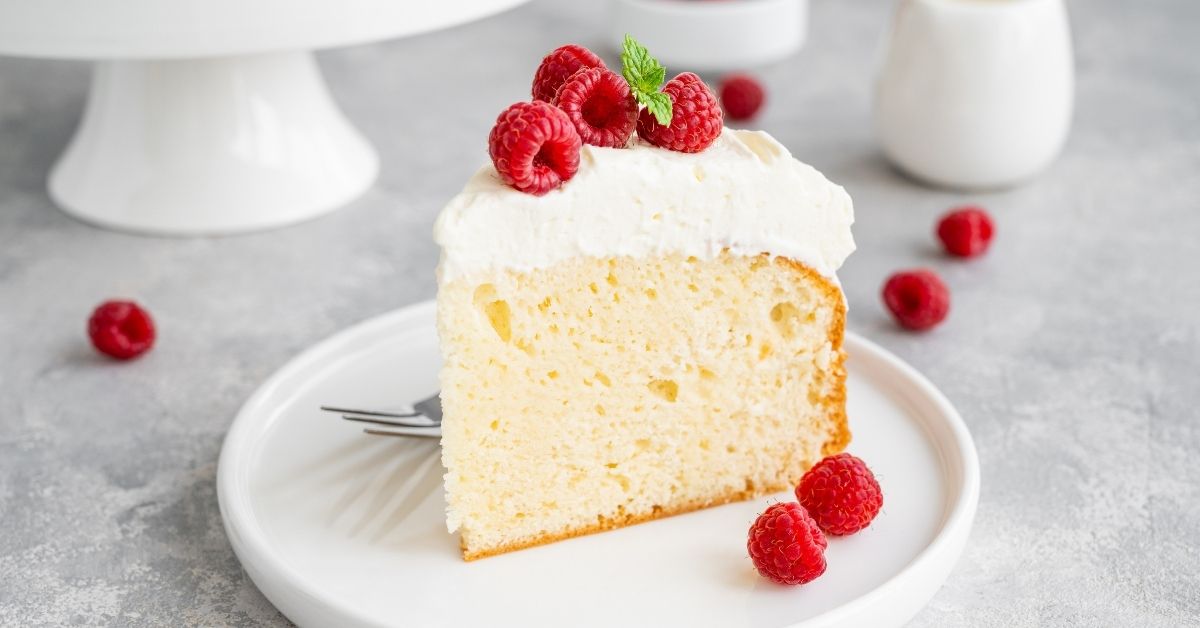 A Slice of Tres Leches Cake with Raspberries