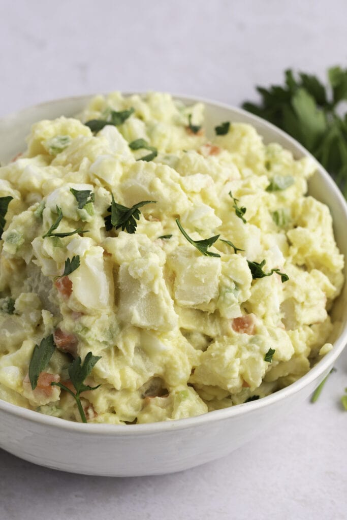 Amish Potato Salad Served in a White Bowl