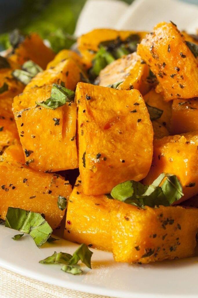 33 Easy Butternut Squash Recipes For Fall featuring Baked Butternut Squash with Herbs
