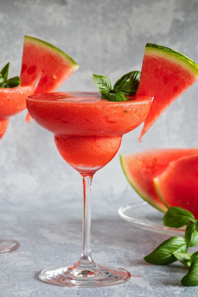 20 Easy Alcoholic Slushies for Summer Parties featuring Boozy Vodka Watermelon Slushy with Fresh Watermelon Slices