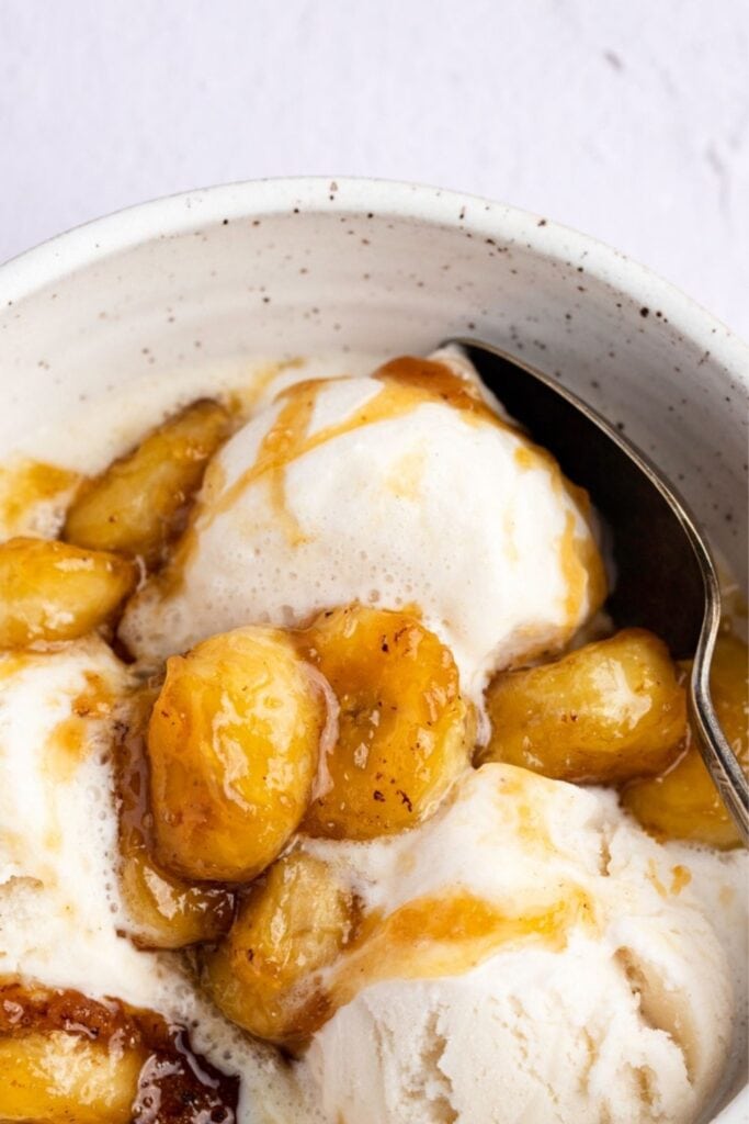 Close up of Vanilla Ice Cream Topped With Caramelized Bananas