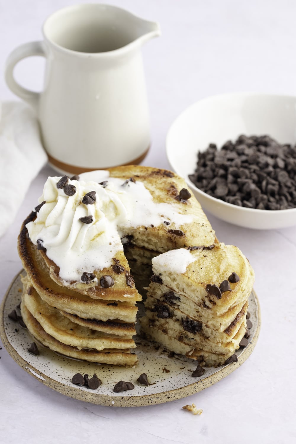 Stack of Chocolate Chip Pancakes with whipped cream on top