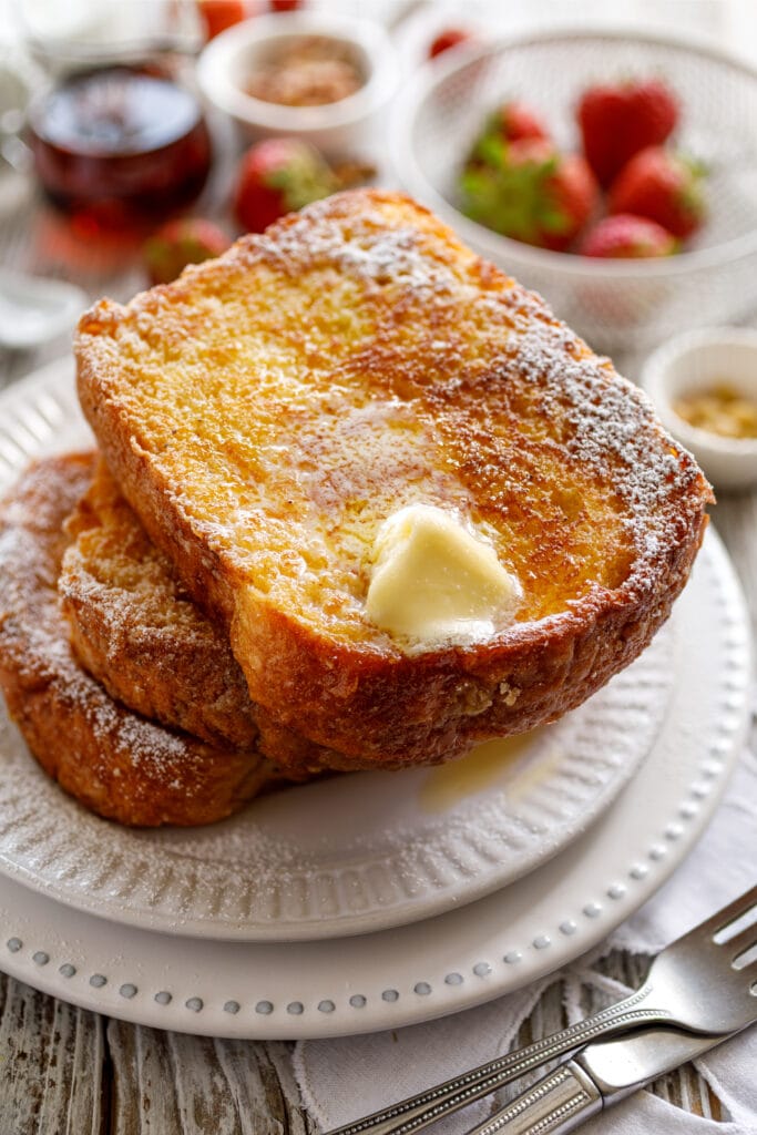 Denny's French Toast with Butter on White Plate