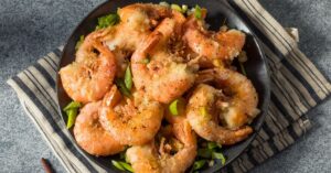 Garlic Shrimp with Green Onions in a Black Plate