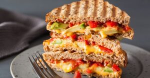 Gooey Grilled Cheese Sandwich with Avocados and Tomatoes