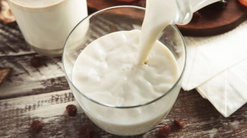 Half and Half Milk Pouring in a Glass