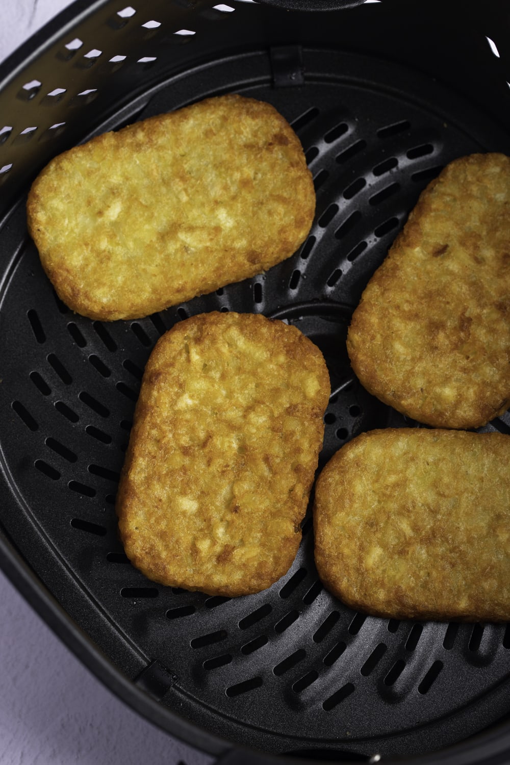 Hash Browns in and Air Fryer basket