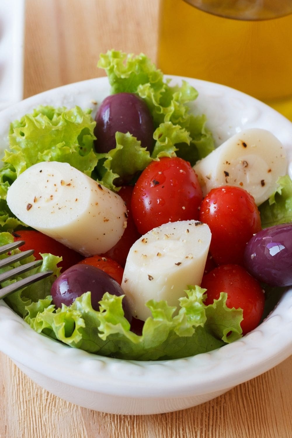 Palm hearts salad with cherry tomatoes and olives