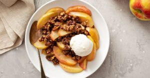 Homemade Apple Crumble with Apple Slices and Ice Cream