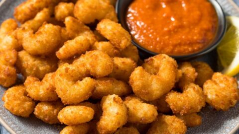 Homemade Crispy and Crunchy Popcorn Shrimp with Sauce and Lemons