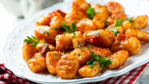 Homemade Potato Gnocchi with Tomato Sauce in a White Plate