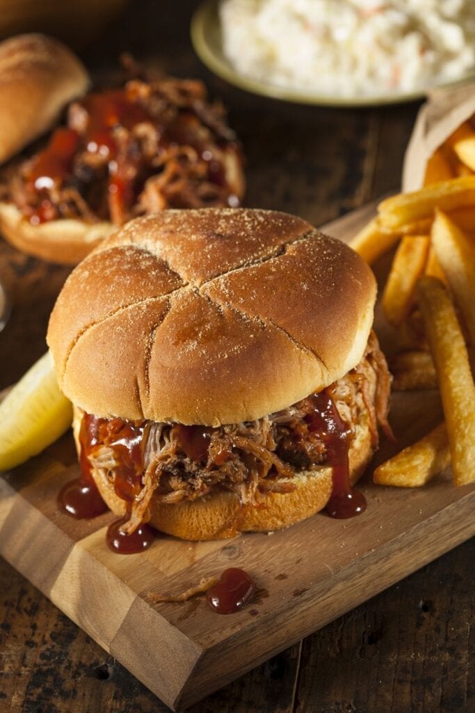 35 Easy Slow Cooker Pork Recipes You'll Love featuring Homemade Pulled Pork Sandwich with Fries