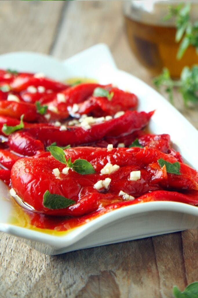 20 Easy Roasted Red Pepper Recipes featuring Homemade Roasted Red Pepper in a Plate