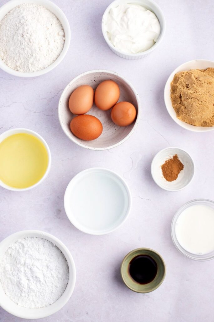 Honey Bun Cake Ingredients - Yellow Cake Mix, Eggs, Sour Cream, Vegetable Oil, Brown Sugar, Cinnamon and Vanilla Glaze