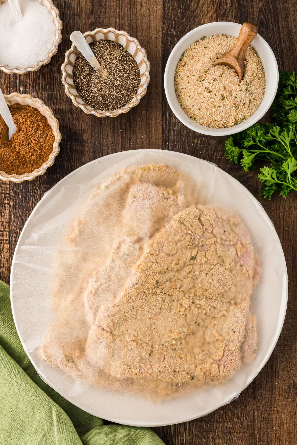 Battered cutlets with plastic wrap in a plate