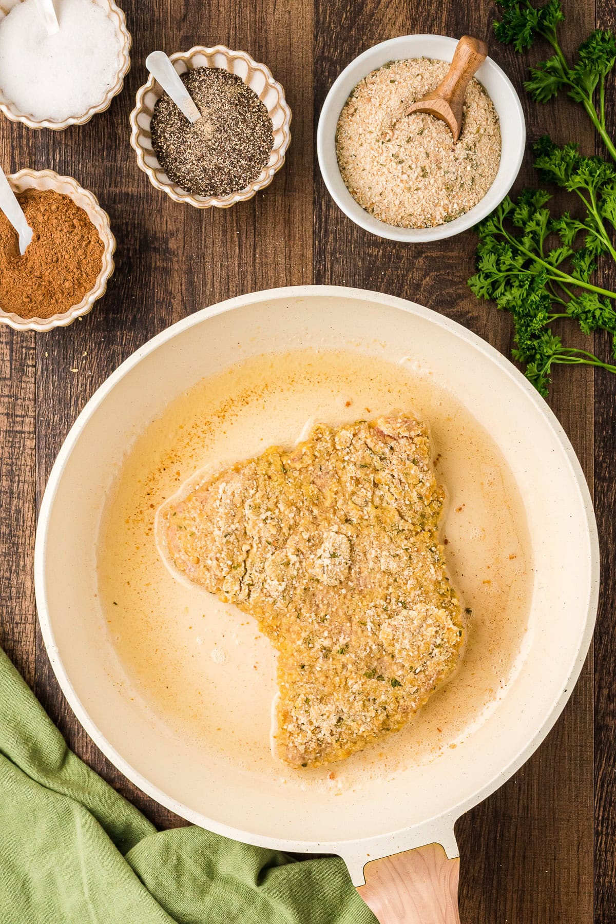 Frying veal cutlet in a large skillet