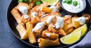 Yuca Fries with Lime and Cream Sauce in a Black Plate