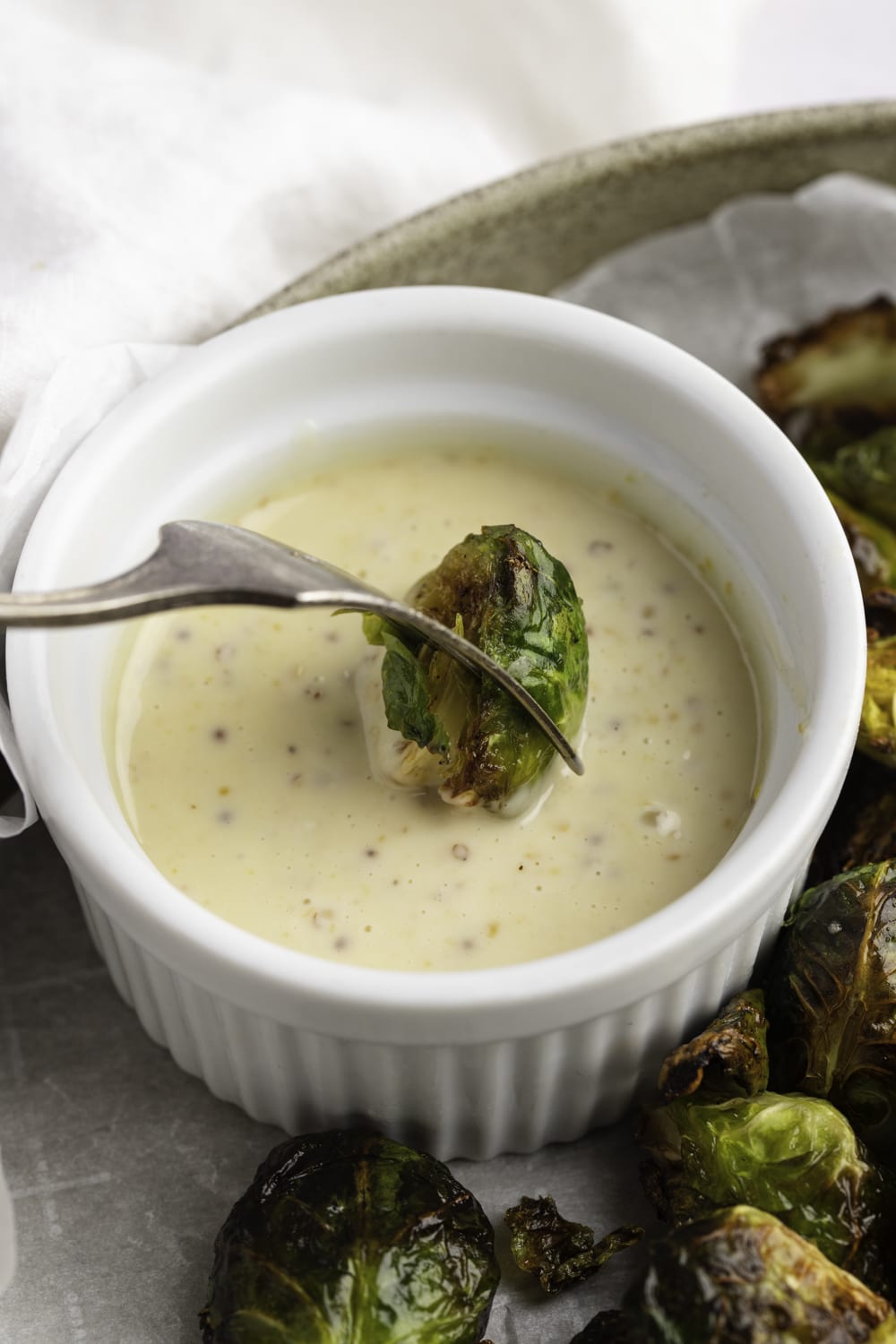 Air Fryer Brussels Sprouts dipped in a Mayo and Mustard Sauce