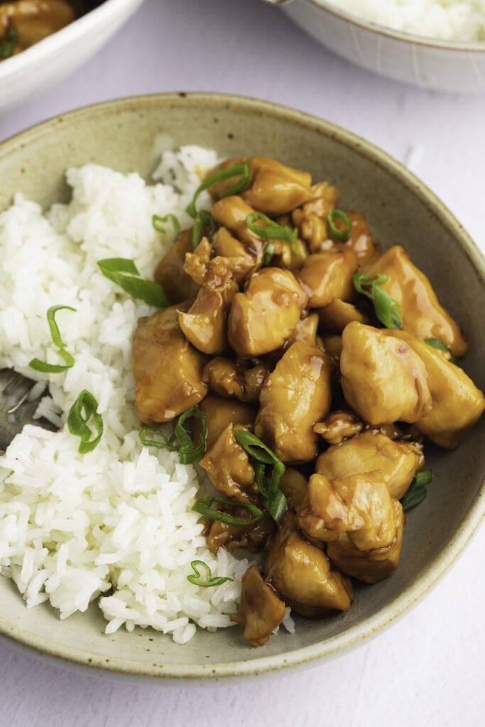 Glazed Bourbon Chicken Served With Rice in a Bowl