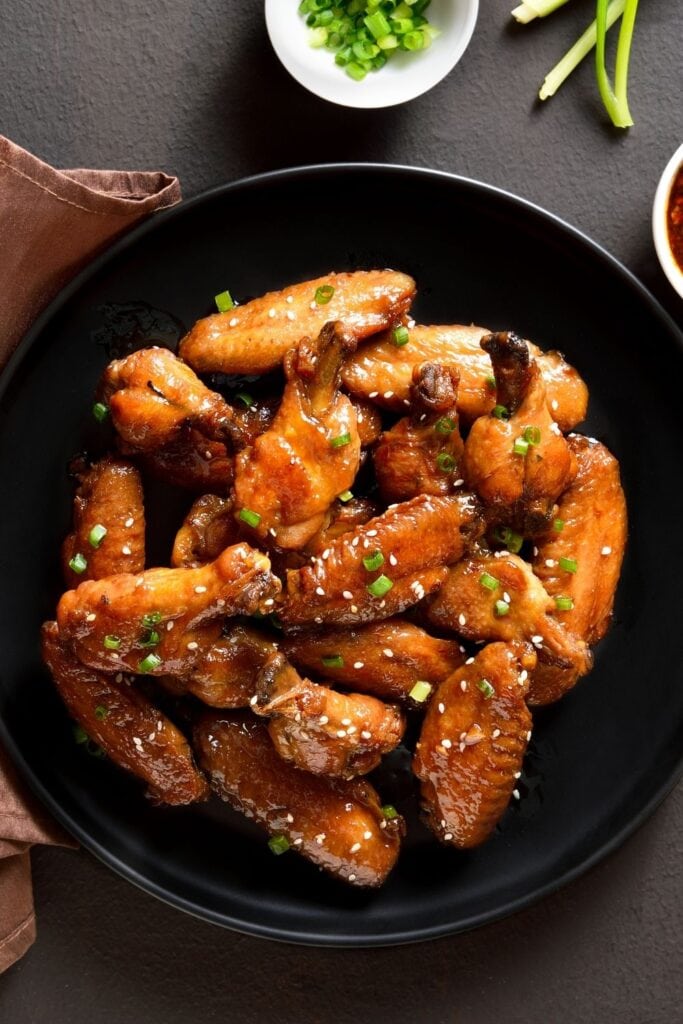 Easy Recipes with Jack Daniel’s featuring Glazed Chicken Wings on a Black Plate