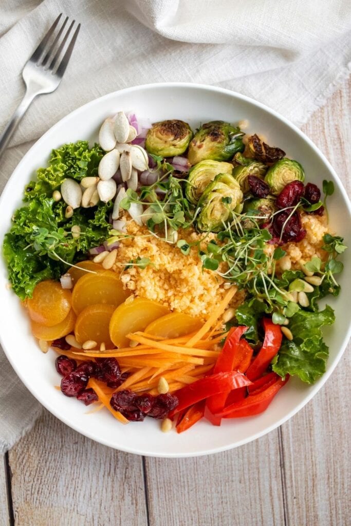 Health Rice Salad Bowl with Gold Beets, Brussel Sprouts, Carrots and Couscous
