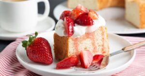 Homemade Angel Food Cake with Whipped Cream and Fresh Strawberries