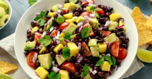 Homemade Avocado and Mango Salsa with Tomatoes and Black Beans