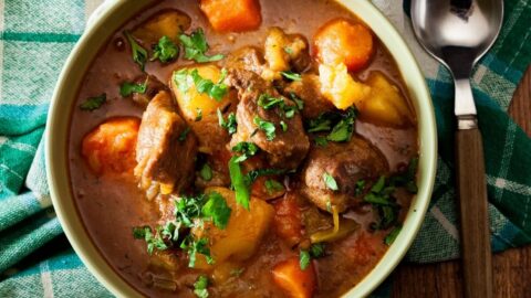 Homemade Beef Stew with Carrots, Potatoes and Herbs in a Bowl