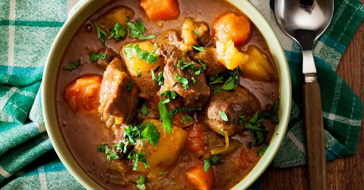 Homemade Beef Stew with Carrots, Potatoes and Herbs in a Bowl