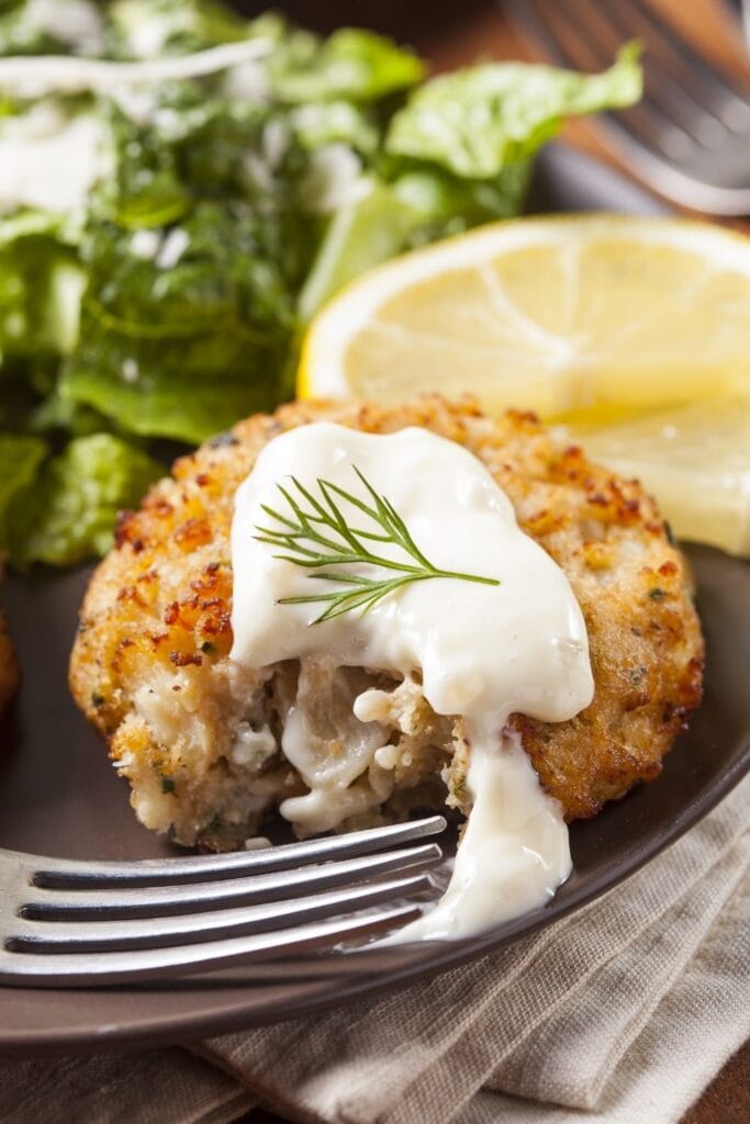 33 Tasty Crab Meat Recipes featuring Homemade Crab Cake with Lemon and Tartar Sauce