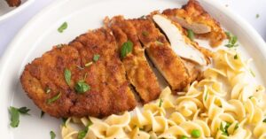 Homemade Crispy and Crunchy Chicken Schnitzel with Noodles