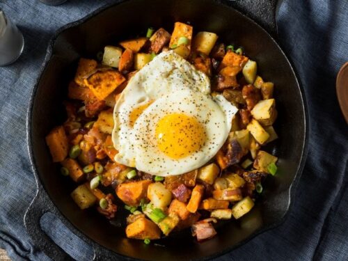 https://insanelygoodrecipes.com/wp-content/uploads/2022/04/Homemade-Healthy-Sweet-Potato-Hash-with-Eggs-in-a-Skillet-500x375.jpg