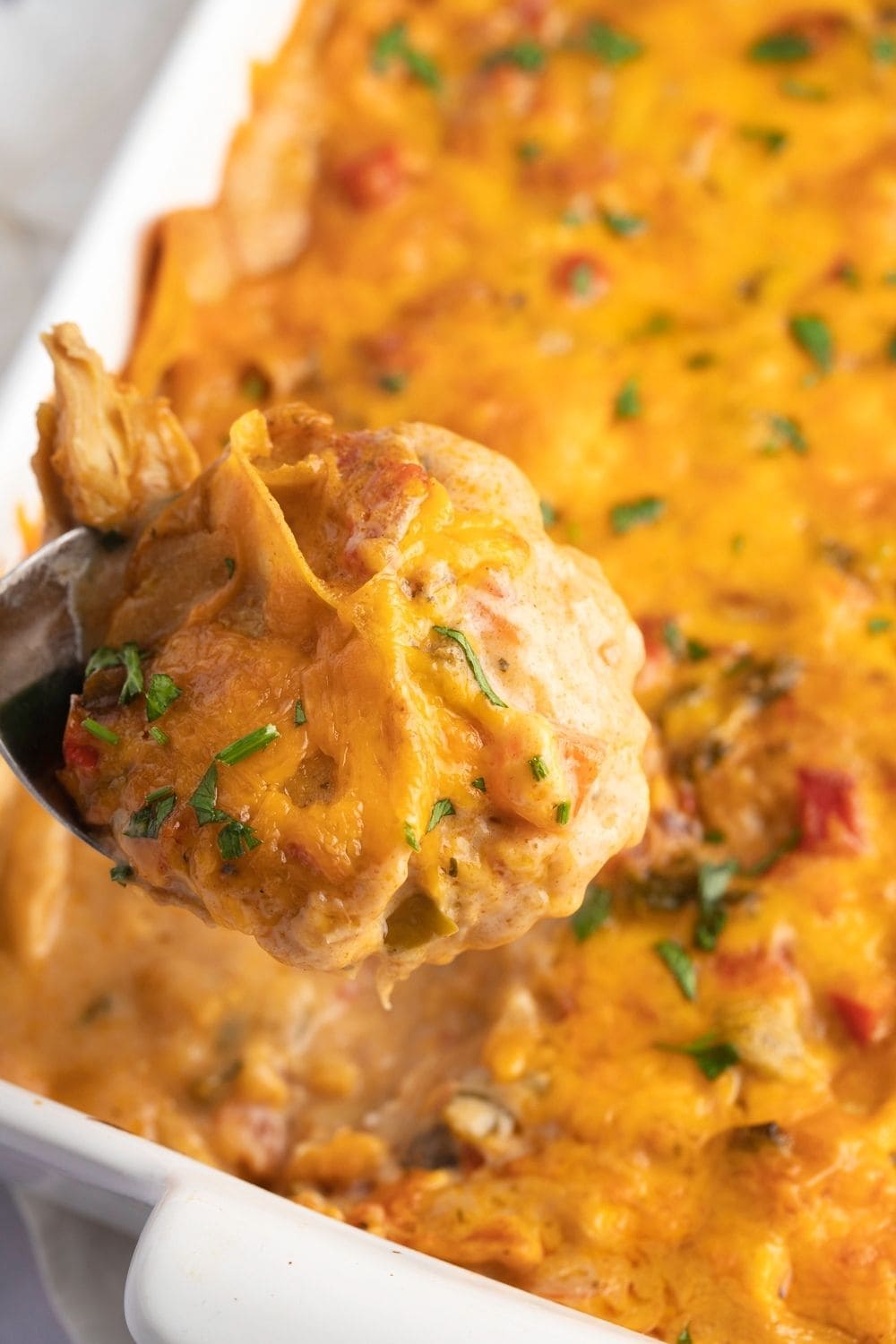 Spoonful of cheesy King Ranch chicken casserole. 