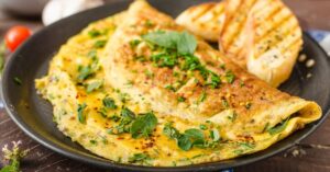 Homemade Omelette Sprinkled with Chives and Spices