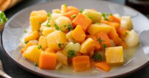 Homemade Root Vegetables with Rutagaba and Carrots in a White Plate