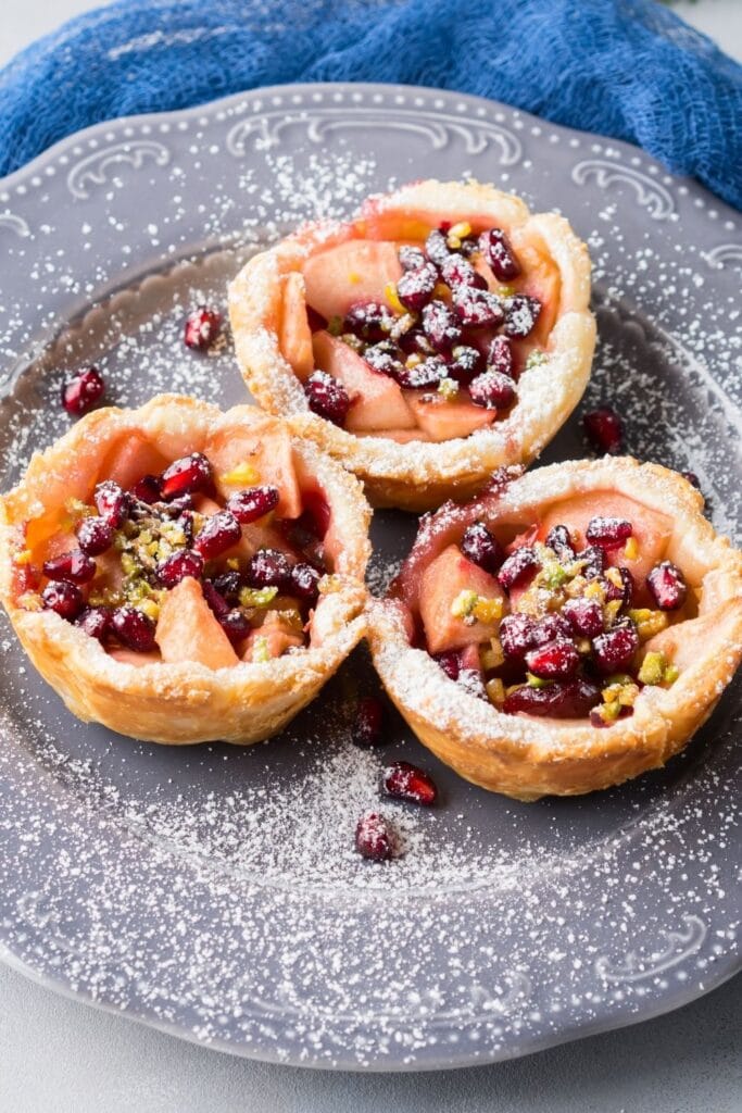35 Easy Mini Pie Recipes featuring Mini Apple Pie with Pomegranate