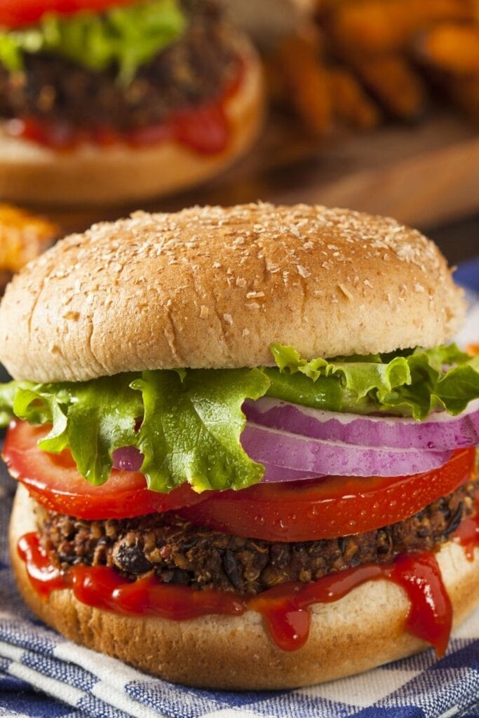 17 Vegan Burger Recipes That’ll Make You Drool featuring Vegan Quinoa Burger with Vegetables and Ketchup