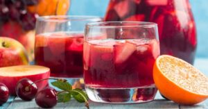 Boozy and Refreshing Pitcher Sangria Cocktail with Orange, Apple and Cherries