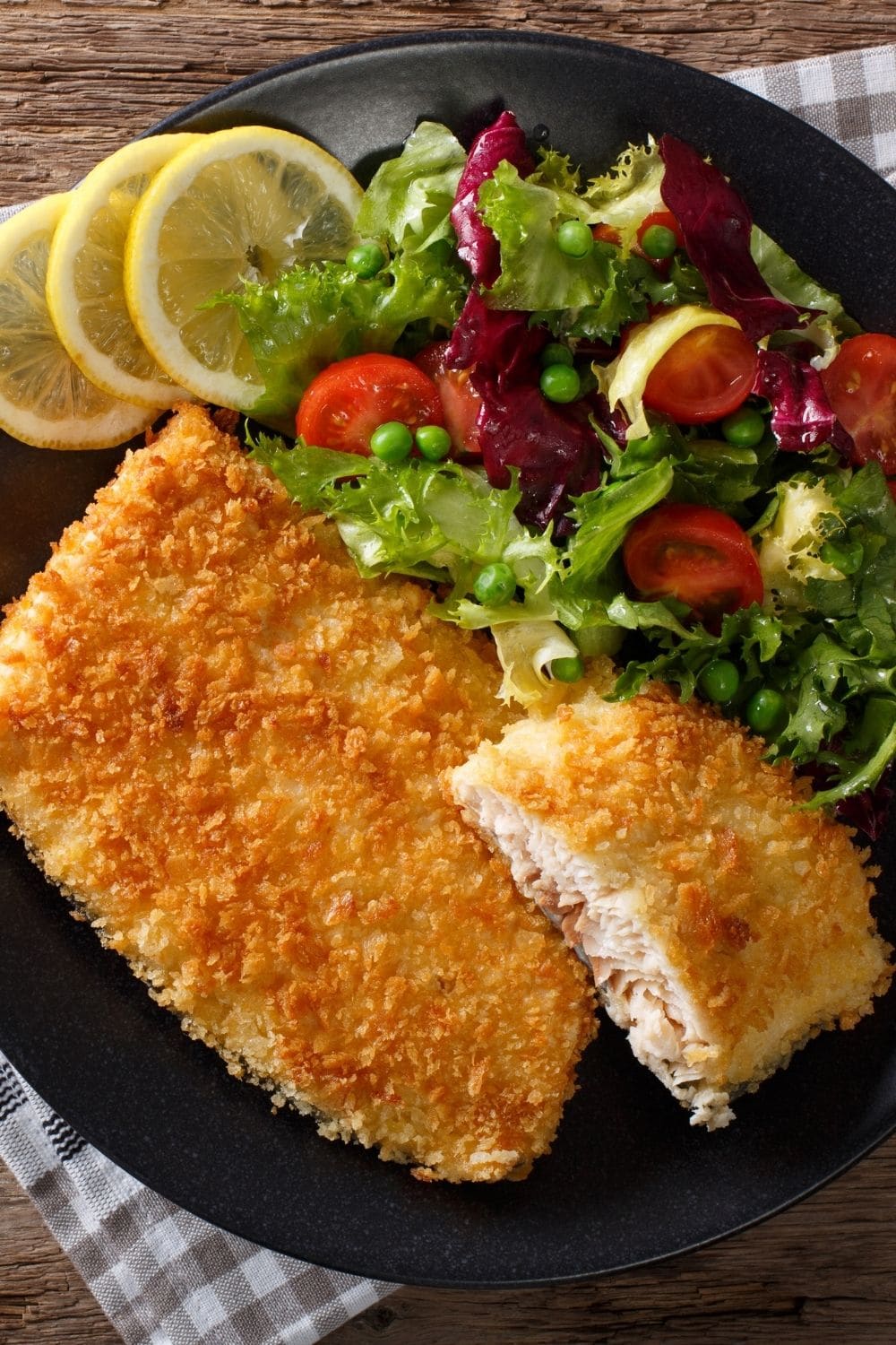 Walleye breaded with lemons and vegetables