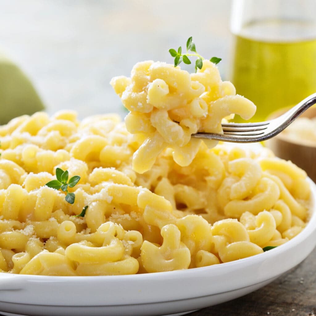 Creamy Old fashioned Mac and Cheese on a White Plate