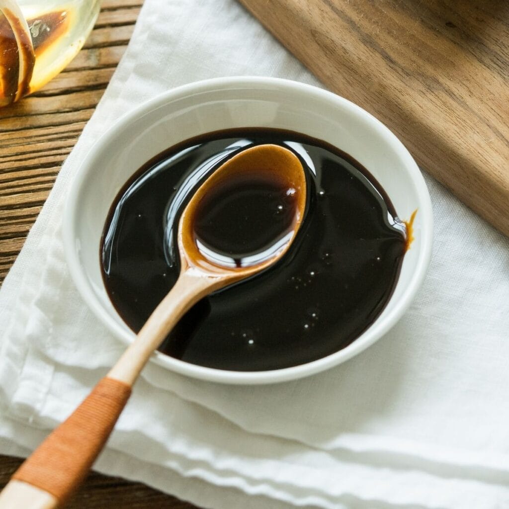 Sorghum Syrup in a small bowl with a spoon
