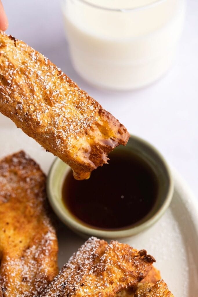 Dipping French Toast Stick in a Sauce