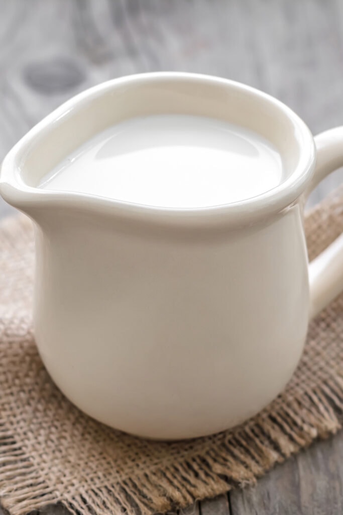 Evaporated Milk In A White Porcelain Pitcher