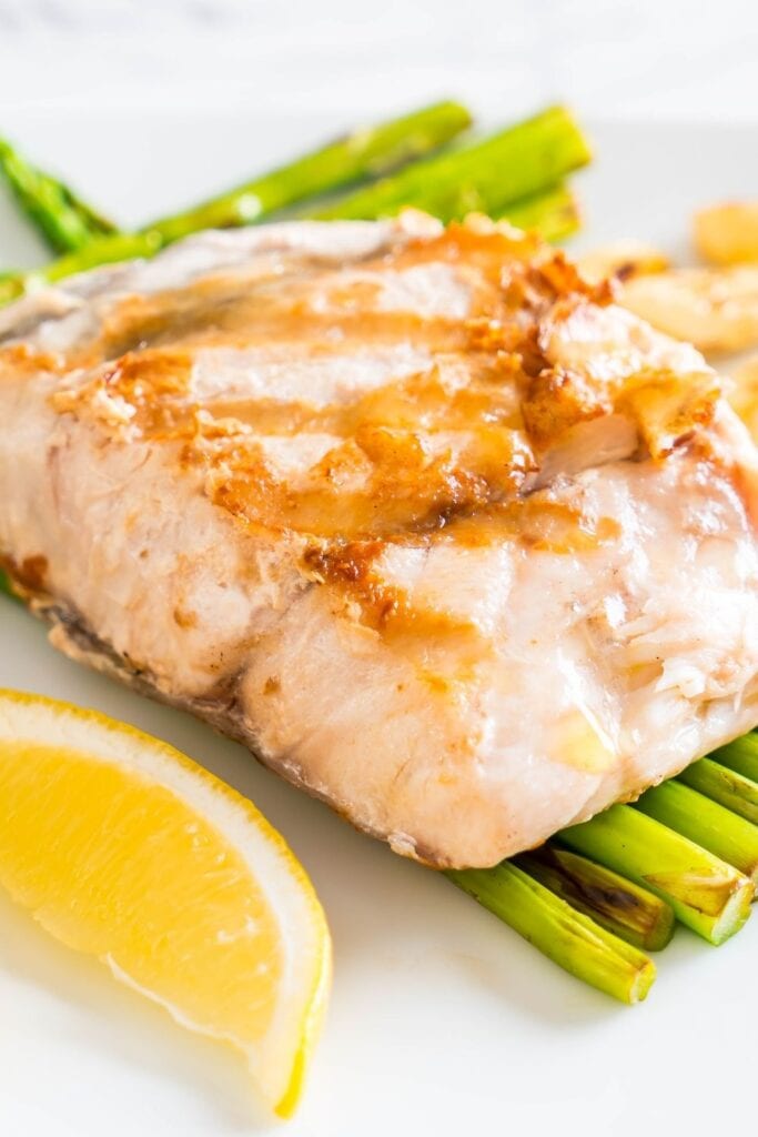 Grilled Snapper Fish Steak with Lemons and Asparagus