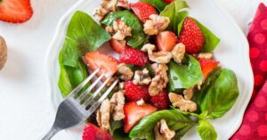 Healthy Strawberry Salad with Aragula and Peanuts