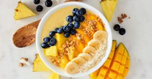 Homemade Breakfast Smoothie bowl with Blueberries, Mangoes, Oats and Bananas