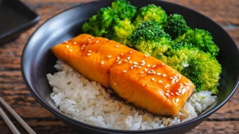 Homemade Teriyaki Salmon with Broccoli, Rice and Sesame Seeds in a Black Bowl